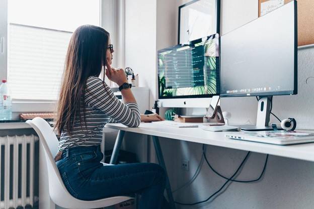 Woman sitting at an ergonomically correct desk